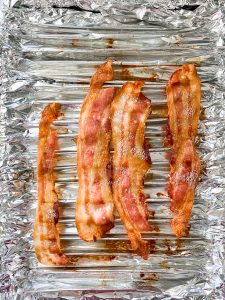 oven-baking-bacon-with-tin-folds