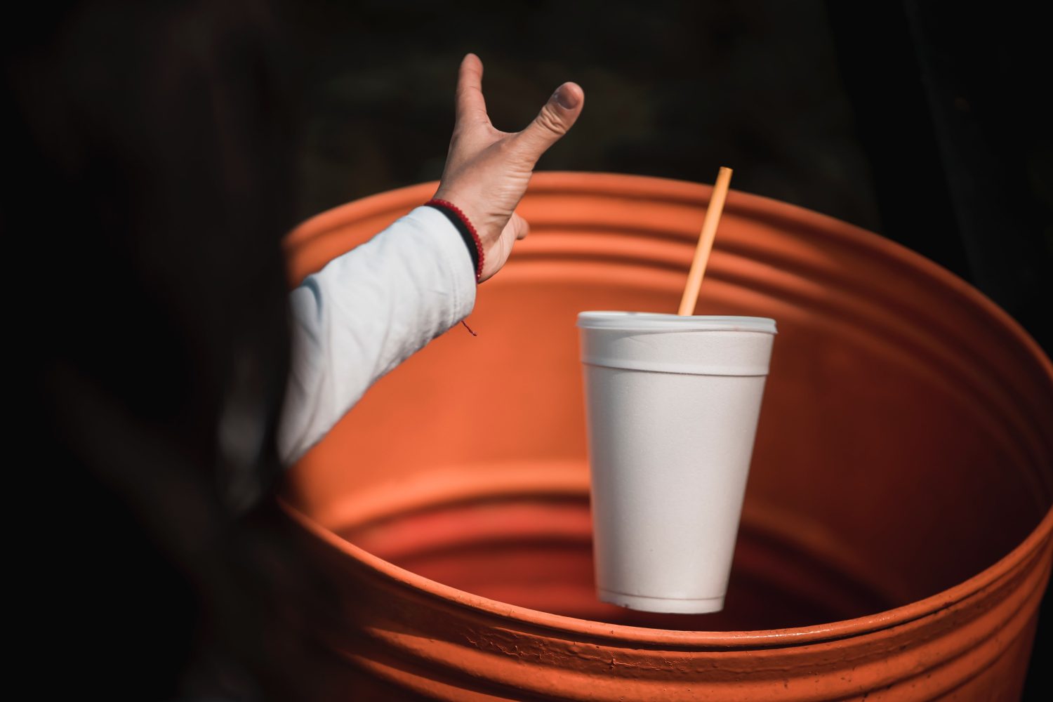 styrofoam-cup-into-garbage