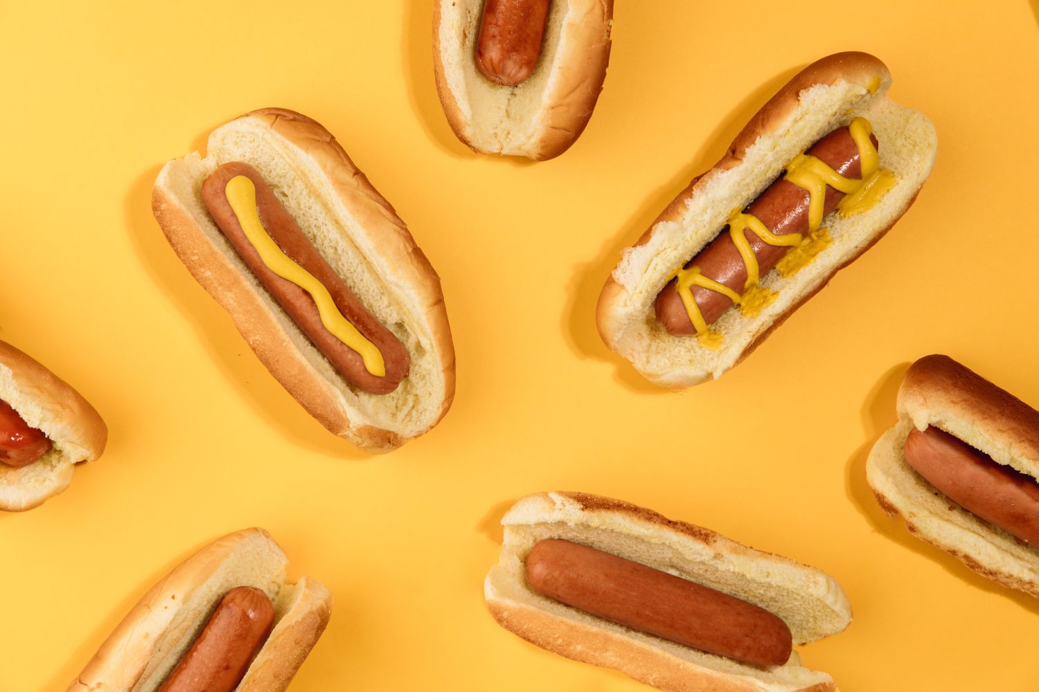 hotdogs-with-yellow-background