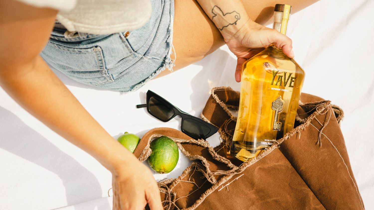 tequila-sunglasses-and-lime-in-a-girls-purse