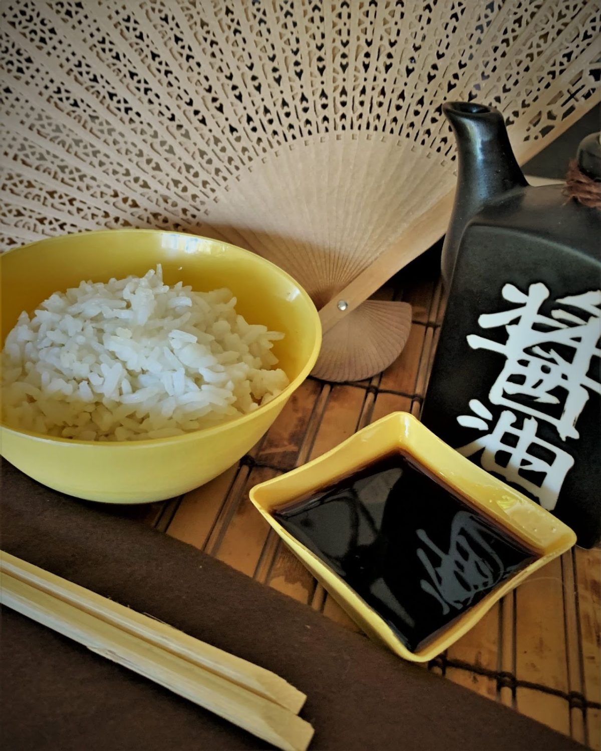 bowl-of-rice-with-chopsticks-and-soy-sauce
