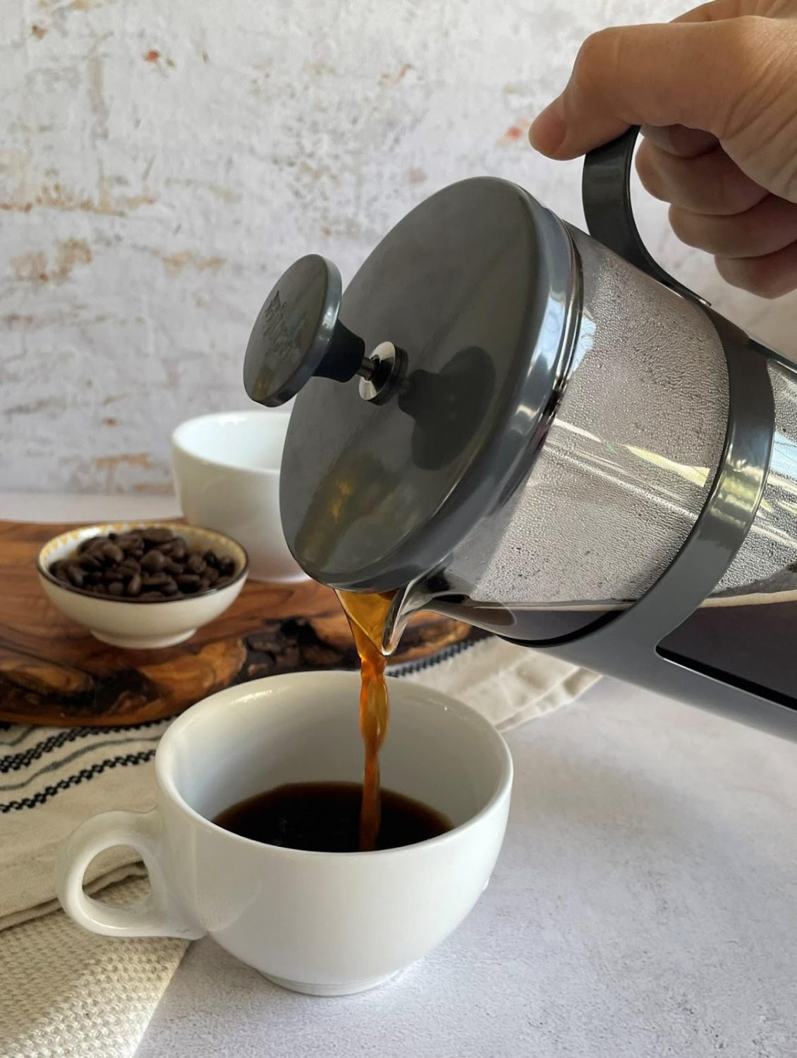 pouring-french-press-coffee-into-mug