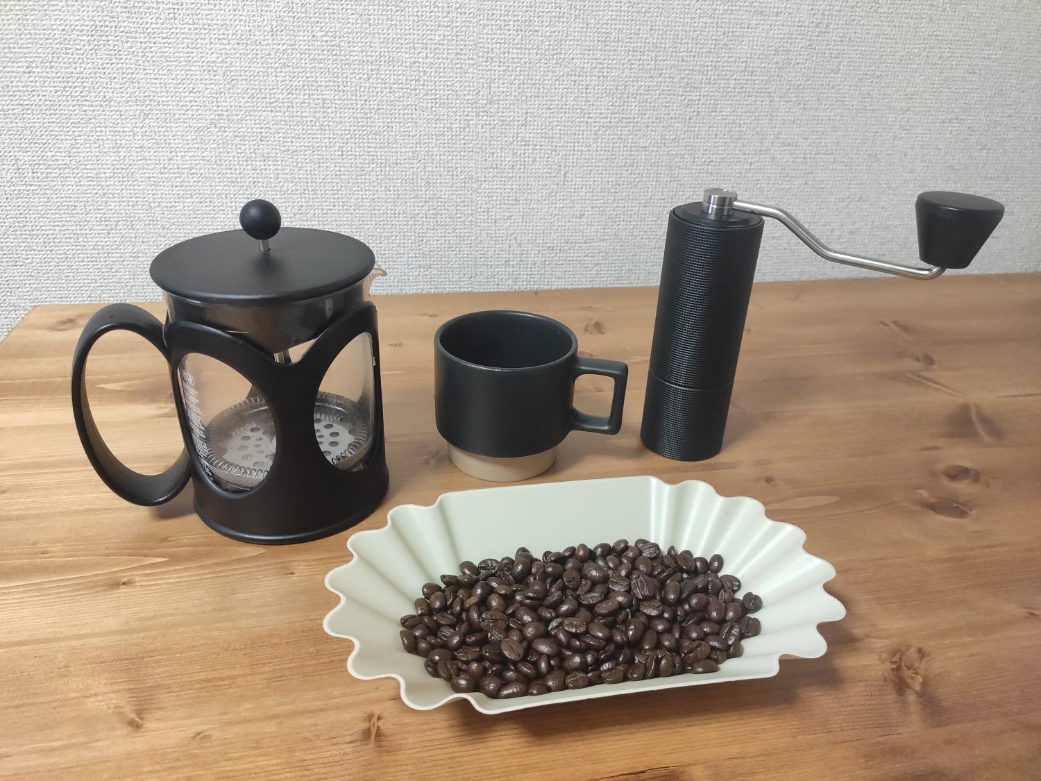 french-press-and-grinder-and-coffee-beans